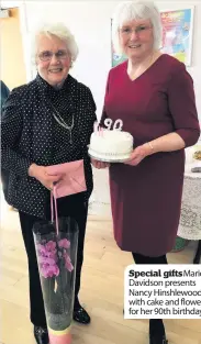  ??  ?? Special giftsMario­n Davidson presents Nancy Hinshlewoo­d with cake and flowers for her 90th birthday