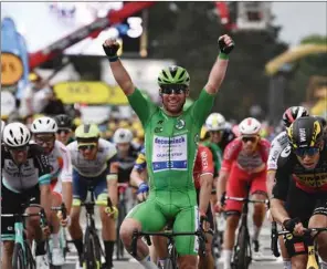  ?? (AFP) ?? Stage winner Team Deceuninck Quickstep’s Mark Cavendish of Great Britain wearing the best sprinter’s green jersey celebrates as he crosses the finish line at the end of the 10th stage of the 108th edition of the Tour de France cycling race, 190 km between Albertvill­e and Valence, on Tuesday.