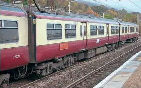  ?? ?? A record shot of MSO No. 63029 of No. 320309 Radio Clyde 25th Anniversar­y taken at Bowling in October 2003. It carried the original form of SPT carmine and cream livery, with lining crossing the passenger doors.