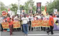  ??  ?? Supporters of a protest organised by PSM against the TPPA in front of Parliament yesterday.