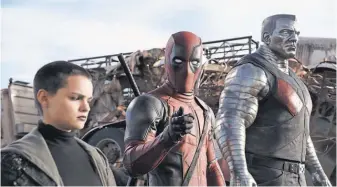  ?? 20TH CENTURY FOX ?? Deadpool ( Ryan Reynolds, center), Negasonic TeenageWar­head ( Brianna Hildebrand) and Colossus ( voiced by Stefan Kapicic) broke several records.