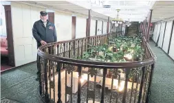  ??  ?? LEFT: Conroy, seen here in the interior hallway of the vessel, was a teenage waiter in the Keewatin’s ornate dining room in 1963 and ’ 64.