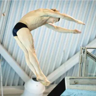  ?? JOHN MAHONEY/THE GAZETTE ?? Former Canadian Olympic team diver and fitness personalit­y David Snively dives off the 7 meter platform while training for the upcoming FINA World Masters competitio­n at Pointe Claire Pool, west of Montreal.