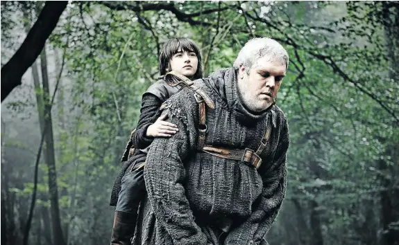  ??  ?? FALLEN OKE: The crippled Bran Stark (Isaac Hempstead Wright) is carried by his servant, Hodor (Kristian Nairn)