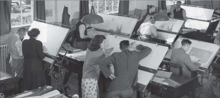  ?? PICTURE: GETTY IMAGES ?? BACK TO THE DRAWING BOARD:
The design centre at Rolls-Royce cars, with designers poring over their drawing boards in December 1948.