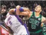  ?? Paul Sancya / Associated Press ?? Pistons center Andre Drummond and Celtics forward Jayson Tatum battle for position for a rebound on Saturday.