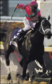  ?? Lynne Sladky The Associated Press ?? Javier Castellano crosses the finish line aboard City of Light to win the $9 million Pegasus World Cup on Saturday at Gulfstream Park.