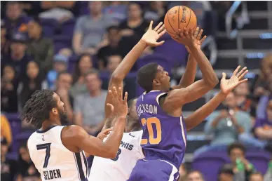  ??  ?? Suns forward Josh Jackson (20) drives to the basket in the first half against the Memphis Grizzlies on Sunday at Talking Stick Resort Arena.