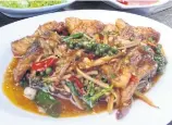  ??  ?? Fried catfish with krachai.