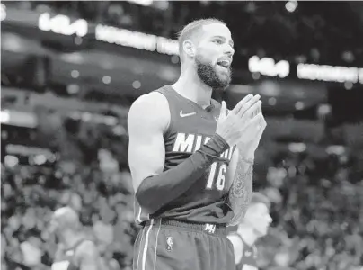  ?? LYNNE SLADKY/AP ?? The Heat’s Caleb Martin reacts during a game against the Raptors on Jan. 29 in Miami. Martin, a North Carolina native, returns to Charlotte to face his twin brother, Cody, and his former team.