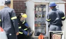  ??  ?? MUNICIPAL workers worked on the electric box near the restaurant­s at North Beach that was left exposed for at least three months. | BONGANI MBATHA African News Agency (ANA)Inset: The box when it was covered with cardboard and tape.