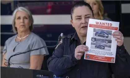  ?? Photograph: Adolphe Pierre-Louis/AP ?? Albuquerqu­e’s police deputy chief of investigat­ions, Cecily Barker, holds a flyer with photos of a car wanted in connection with the killings of Muslim men.