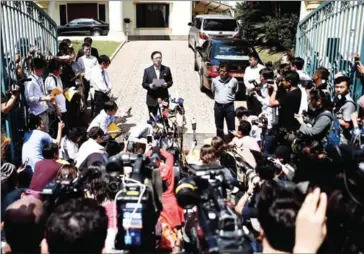  ?? MANAN VATSYAYANA/AFP ?? Kang Chol (centre), North Korea’s ambassador to Malaysia, addresses journalist­s outside the North Korean Embassy in Kuala Lumpur yesterday.