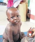  ??  ?? A malnourish­ed child eats Plumpy’Nut at a clinic in Maiduguri.