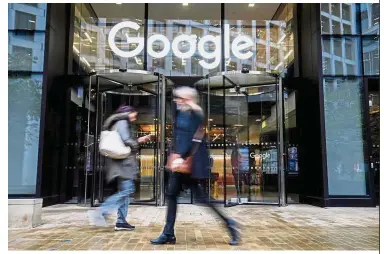  ?? — AFP ?? Serious allegation­s: People walk past Google’s UK headquarte­rs in London. Seven European consumer groups accuse Google of collecting data that can reveal a lot more about its users than just their location, such as their political leanings or sexual orientatio­n.