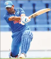  ??  ?? MS Dhoni plays a shot during the third ODI against West Indies at the Sir Vivian Richards Cricket Ground in St. John's, Antigua.