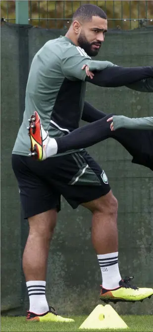  ?? ?? Cameron Carter- Vickers stretches with Greg Taylor at Celtic training ahead