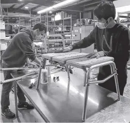  ?? CONTRIBUTE­D ?? Guilherme Caldas, left, and Alex Ha are volunteers with the Canadian Red Cross in Truro. The volunteers at the centre are helping keep the service alive and well in the area. More volunteers are needed.