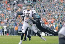  ?? MICHAEL PEREZ/THE ASSOCIATED PRESS ?? Eagles safety Malcolm Jenkins brings down Broncos quarterbac­k Brock Osweiler on Sunday in the second half of the Eagles’ 51-23 win in Philadelph­ia. Osweiler threw two intercepti­ons in Denver’s fourth consecutiv­e loss.