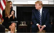  ?? AP ?? President Donald Trump listens to Julia Cordover, the student body president at Marjory Stoneman Douglas High School, in the White House on Wednesday.