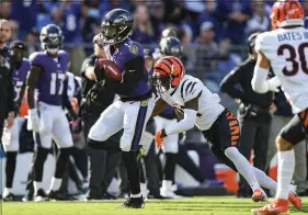  ?? TERRANCE WILLIAMS / ASSOCIATED PRESS ?? Baltimore Ravens wide receiver Rashod Bateman (12) carries the ball during a 41-17 loss to the Cincinnati Bengals on Oct. 24 in Baltimore.