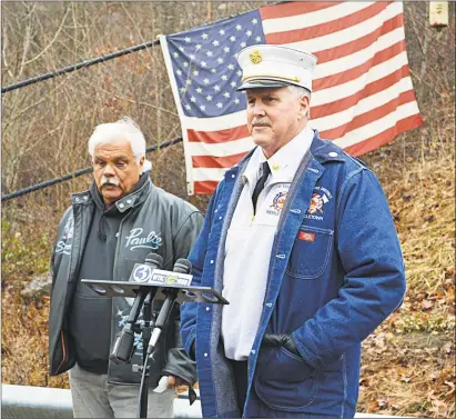  ?? Cassandra Day / Hearst Connecticu­t Media ?? Union workers, officials and families and friends of the Kleen Energy blast victims gathered Thursday morning at the memorial on River Road in Middletown to remember the six men who died Feb. 7, 2010, in the tragic gas explosion. Here, South Fire District Chief Michael Howley, right, and event organizer and former plant worker Paul Venti, left, speak to those in attendance.