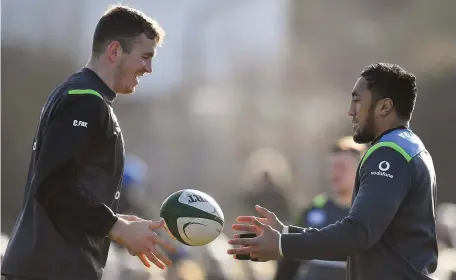  ?? BRENDAN MORAN/SPORTSFILE ?? Chris Farrell and Bundee Aki during the Ireland rugby squad training session at Dubarry Park yesterday