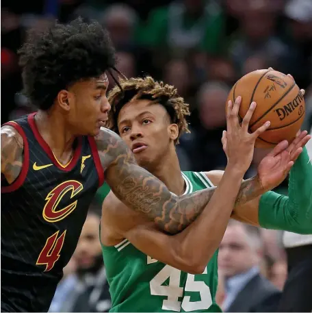  ?? STUART CAHILL / HERALD STAFF FILE ?? ‘ADAPTED WELL’: Celtics rookie Romeo Langford, right, isn’t fazed as Cleveland Cavaliers guard Kevin Porter Jr. attempts to steal the ball on Dec. 27.