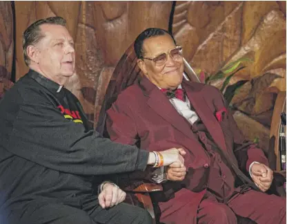  ?? ASHLEE REZIN/ SUN-TIMES ?? The Rev. Michael Pfleger and Nation of Islam leader Minister Louis Farrakhan at St. Sabina Church on May 9.
