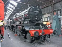  ?? BEN SCOTT ?? 48305: The Stanier ‘8F’ 2-8-0 with boiler and cylinder cladding in place, complete with black topcoat, at Loughborou­gh shed on October 6.