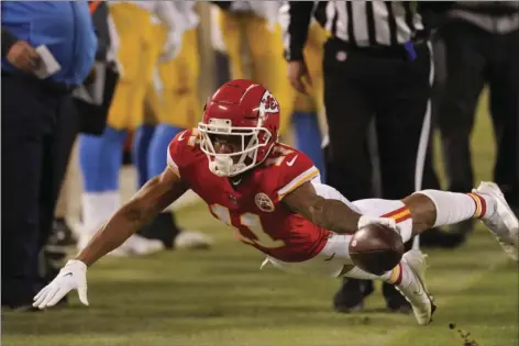  ?? AP PHOTO/CHARLIE RIEDEL ?? Kansas City Chiefs wide receiver Demarcus Robinson dives for extra yardage during the second half of an NFL football game against the Los Angeles Chargers, Jan. 3, in Kansas City.