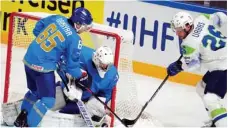  ?? ?? 2023 IIHF Ice Hockey World Championsh­ip: Kazakhstan vs. Slovenia
Kazakhstan’s goalkeeper Andrey Shutov (centre) tries to make a save during the Group B match between Kazakhstan and Slovenia at the 2023 IIHF Ice Hockey World Championsh­ip in Riga, Latvia.