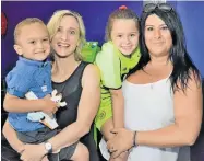  ?? Picture: IVOR MARKMAN ?? PLAY DATE: John, 4, and Orette Moodaley, left, attend ‘The Gruffalo’ with guests Aria, 6, and Pamela Fisher, from Scotland, at the Savoy Theatre on Tuesday afternoon