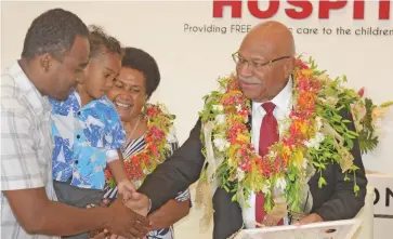  ?? Sai Ronald Kumar ?? Prime Minister Sitiveni Rabuka with wife Suluweti Rabuka awards Uraia Tuicama 2 with his father, Ilaitia Konatora Sanjeevani Children’s Heart Hospital 100 surgery celebratio­n on February 2, 2023. Photo: