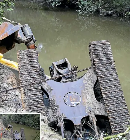  ?? CHRISTEL YARDLEY/STUFF ?? The digger took a tumble into the Mangaonua Gully on July 1 when working on a retaining wall as part of the $5.85m Te Awa River Ride project.