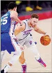  ??  ?? Detroit Pistons forward Blake Griffin (23) drives on Philadelph­ia 76ers guard Ben Simmons (25) during the second half of an NBA basketball game, on Jan 25, in Detroit. (AP)