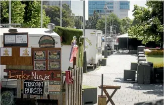  ?? PHOTO: DAVID WALKER/STUFF ?? Cathedral Square taken over by food caravans and their al fresco dining.