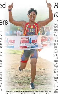  ?? JUN MENDOZA ?? Zedrick James Borja crosses the finish line to rule the boys 13-14 years old category of the Alaska Ironkids Aquathon held in Subic Bay.