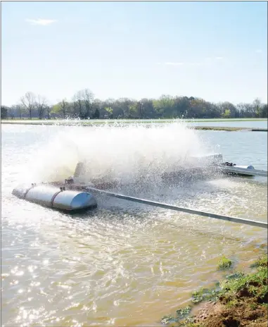  ?? ?? Using surface aerators can help resolve low-oxygen situations in ponds. A powerhouse-style aerator like the ones used on catfish farms can provide a refuge. (File photo by MSU Extension Service/kevin Hudson)