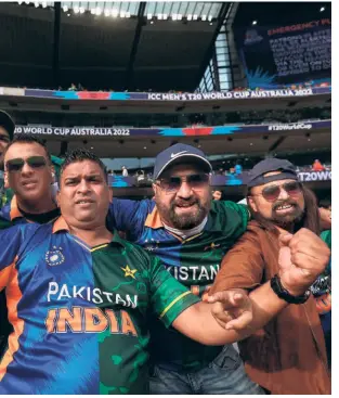  ?? AFP ?? A unifying force:
Fans at the MCG at the T20 World Cup joust between
India and Pakistan.
