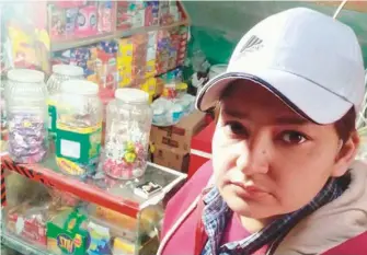  ??  ?? Farheen Ishtiaq works at a corner shop in Lahore’s Anarkali Bazaar.