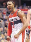 ?? NICK WASS/ASSOCIATED PRESS ?? Washington Wizards guard John Wall (2) scored 18 points and had 18 assists in a win over the Timberwolv­es Friday.