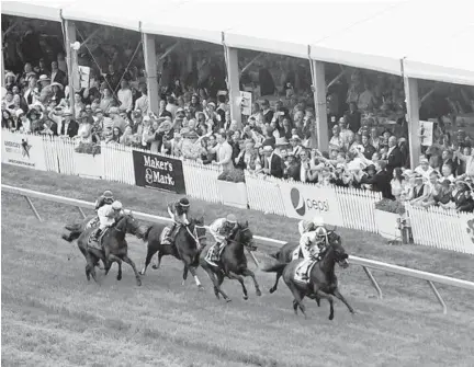  ?? JOSHUA MCKERROW/BALTIMORE SUN MEDIA GROUP ?? Stallion Heiress (4) leads the pack ahead of Brooks House (inside rail) and Ultra Brat (3) as they pass the Turfside Terrace in the Gallorette Stakes. It was the only race run on turf.