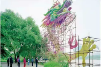  ??  ?? People Doing Morning Exercise under a Dragon Lamp in Gansu by Zhang Kechun, archival inkjet print, 100×120cm, 2011.