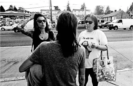  ?? ELAINE THOMPSON/AP ?? Volunteers Justice Rivera, left, and Laura LeMoon provide harm reduction services to sex workers in Seattle.