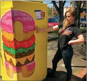  ?? SUBMITTED ?? Genevieve St. Charles of Seattle poses by her Eureka utility box creation during a past Eureka Street Art Festival.