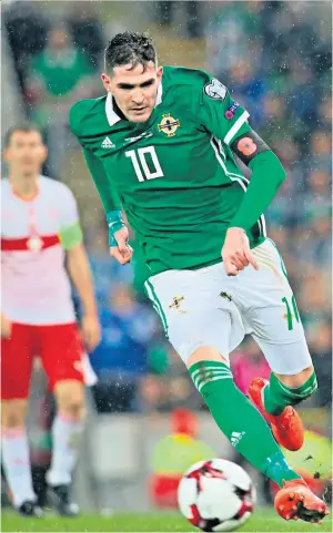  ??  ?? Focused: Kyle Lafferty, in action against Switzerlan­d on Thursday, is happier both with his football and his life since tackling his demons