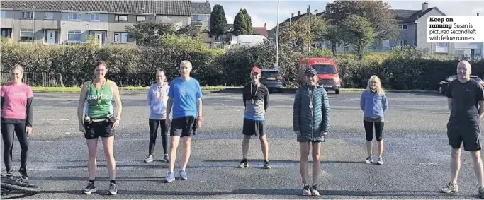  ??  ?? Keep on running Susan is pictured second left with fellow runners