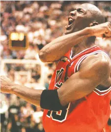  ?? ROBERT SULLIVAN/AFP/GETTY IMAGES ?? Basketball legend Michael Jordan celebrates in June 1998 after his Bulls defeated the Utah Jazz to capture their sixth NBA championsh­ip.