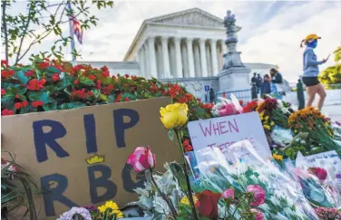  ?? J. Scott Applewhite / Associated Press ?? Ruth Bader Ginsburg was memorializ­ed outside the Supreme Court on Saturday, the day after her death.